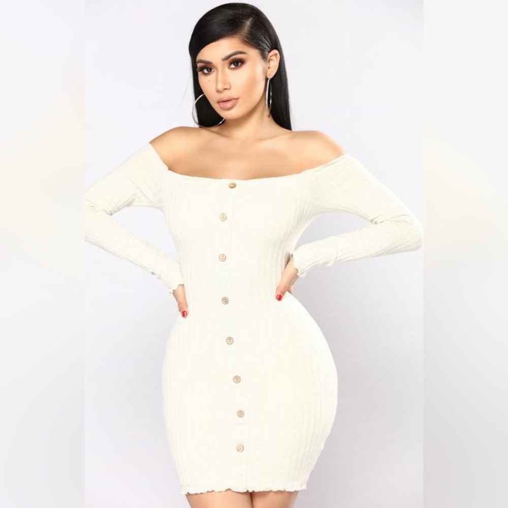 Tight fitting, off white sweater dress.